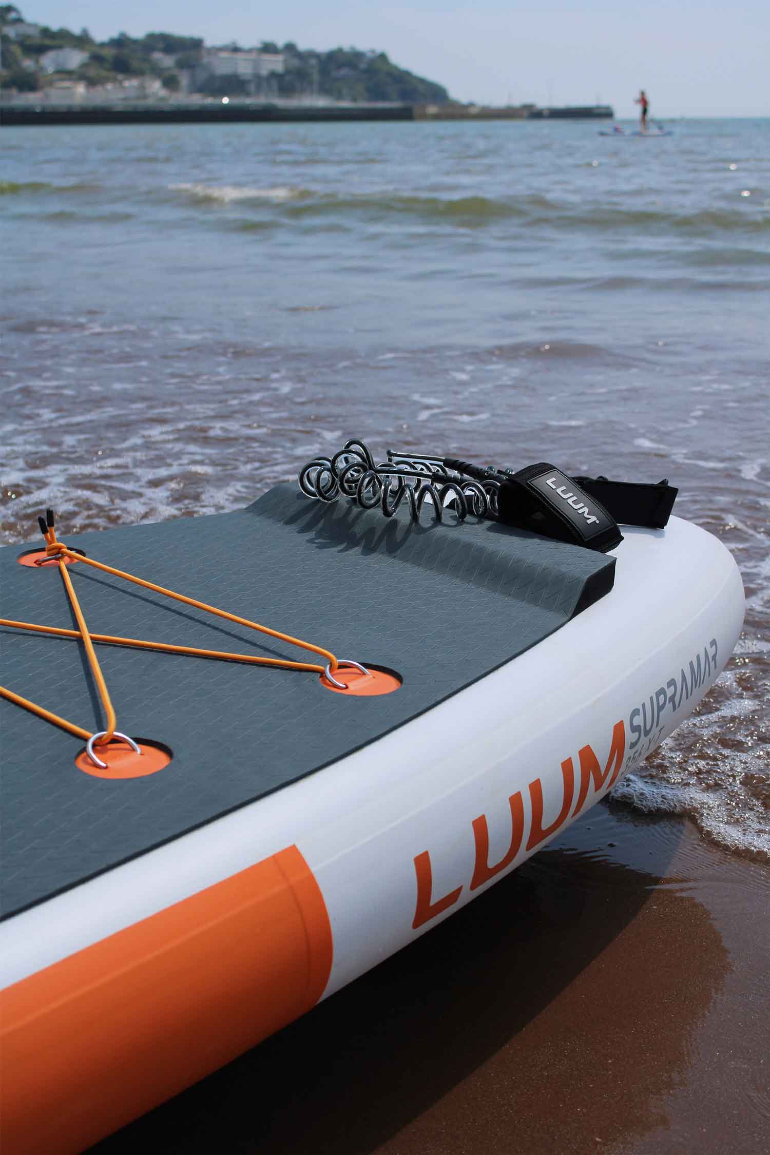 inflatable touring paddleboard on beach